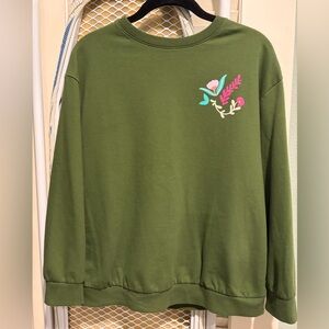 Green crewneck sweatshirt with floral design